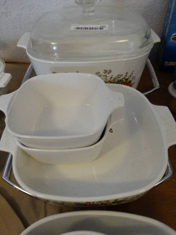 lot 295 image: Lot of Corningware dishes cookware & stands