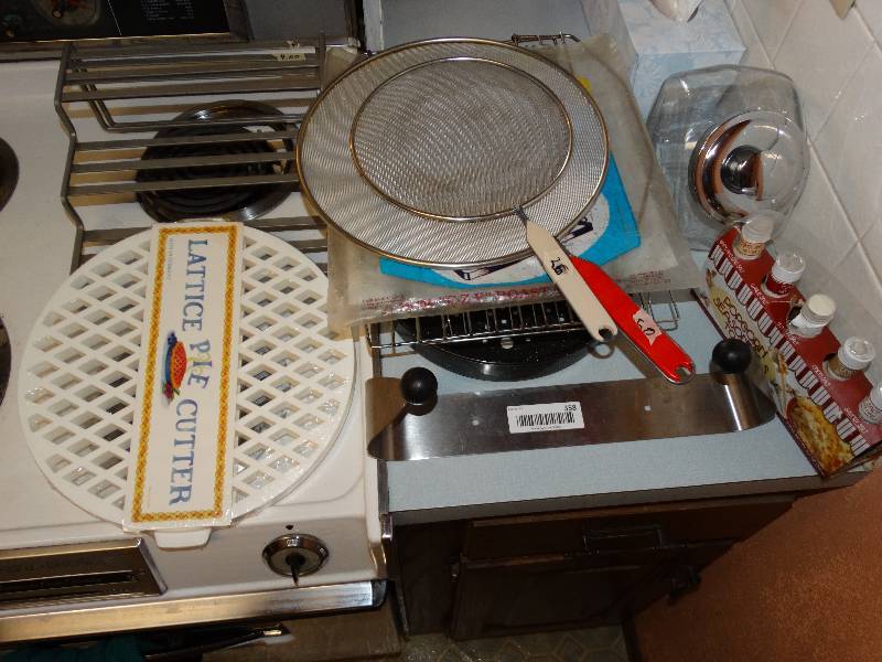 lot 358 image: Baking racks, screens, paper towel holder, pie crust cutter, spice racks,candy jar