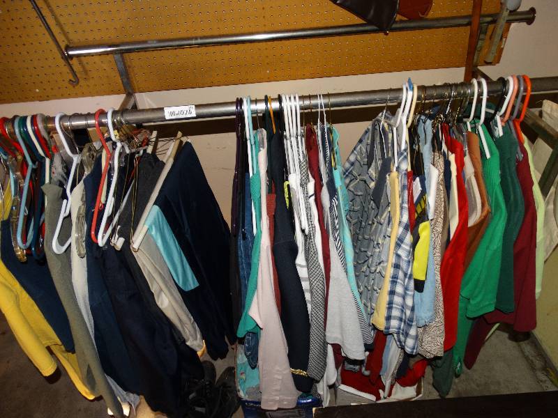lot 391 image: Clothing rack w contents, snow boots & 2 boxes of various clothes
