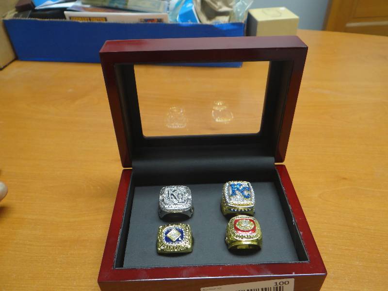lot 100 image: Set of 4 replica KC championship rings in wood case