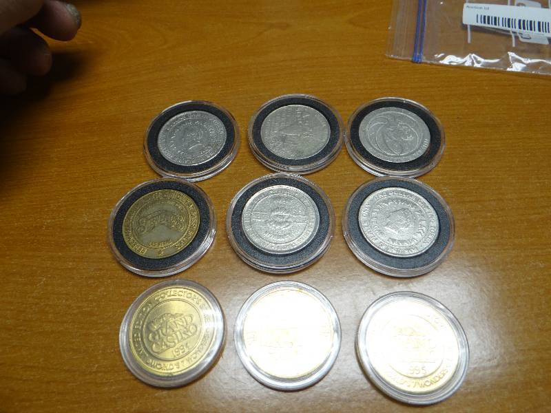 lot 105 image: Collection of 9 various casino coins tokens in plastic