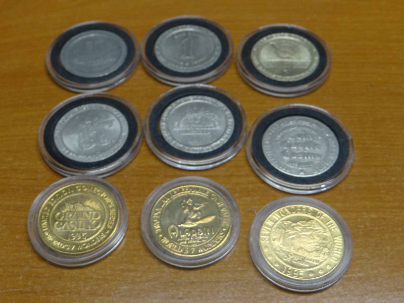 lot 115 image: Collection of 9 various casino coins tokens in plastic