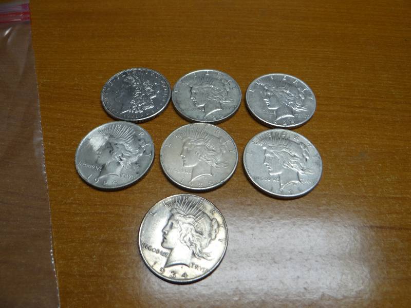 lot 121 image: 7 silver dollars- 1921, 1922, 1923, 1924, 1925, 1926, 1934