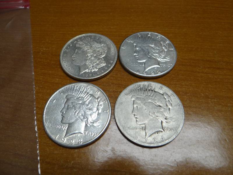 lot 122 image: 4 silver dollars- 1921, 1922, 1923, 1924