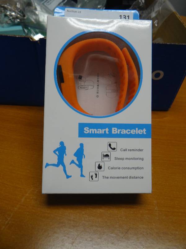 lot 131 image: Orange smart bracelet- new in box