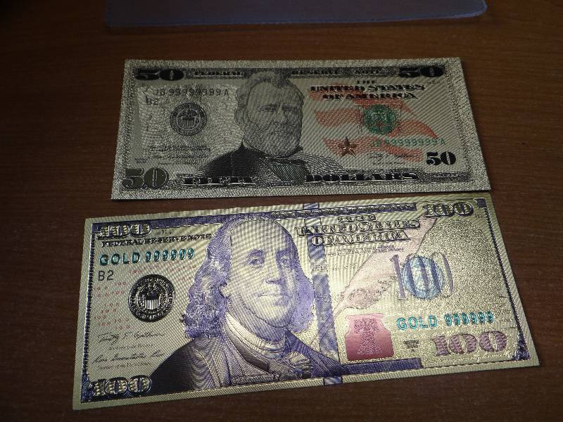 lot 141 image: (2) 24k gold display bank notes in plastic