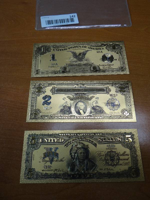 lot 142 image: (3) 24k gold display bank notes in plastic
