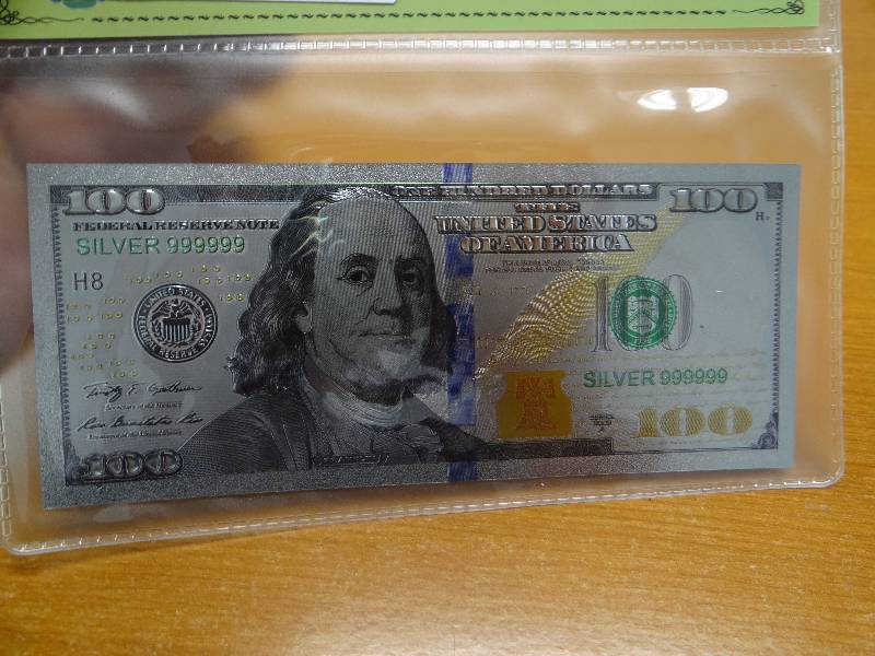 lot 147 image: 99.9 silver bank display note in plastic