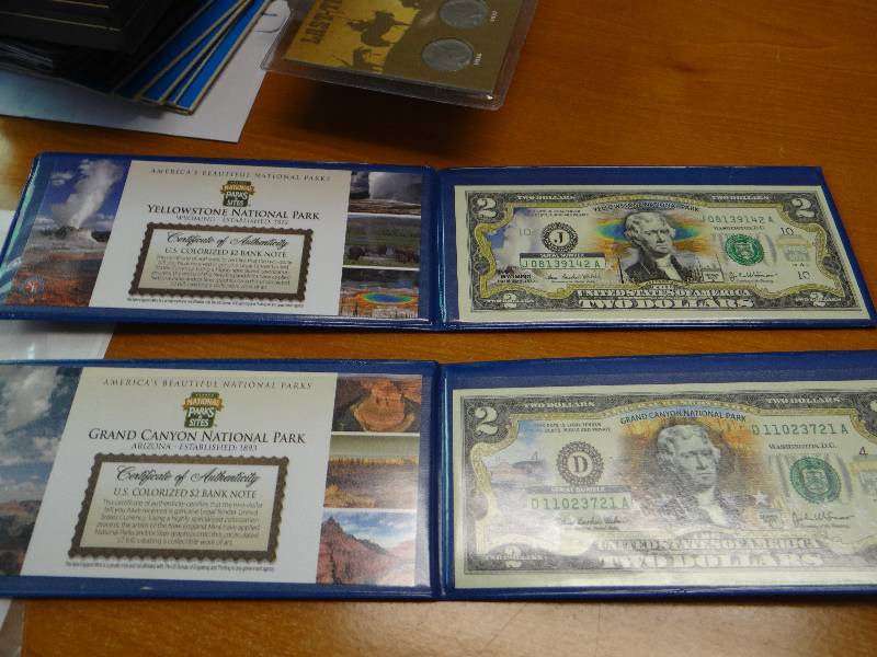 lot 151 image: Yellowstone national park $2 bill & Grand Canyon National Park $2 bill in plastic