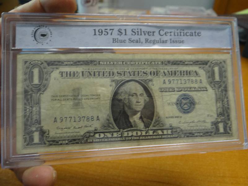lot 158 image: 1957 blue seal silver certificate in plastic case