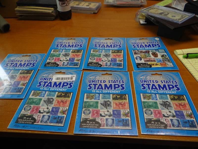 lot 159 image: 7 packages of stamps- 15 in each package