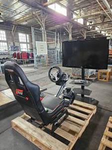 lot 21587 image: Playseat Racing chair W 42in LG TV