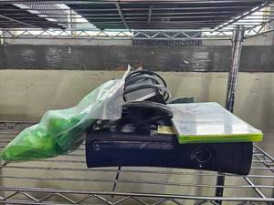 lot 21648 image: Xbox 360, 2 controllers, and Rage Game