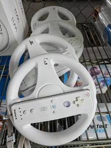 lot 21611 image: (4) Wii Wheels W Remote
