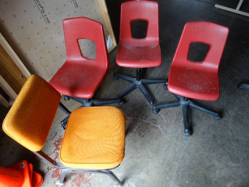 lot 659 image: 3 red swivel rolling chairs 1 orange chair