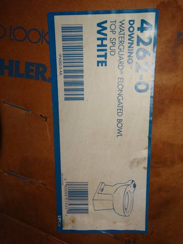 lot 600 image: 2 Kohler toilet bowls- New in boxes