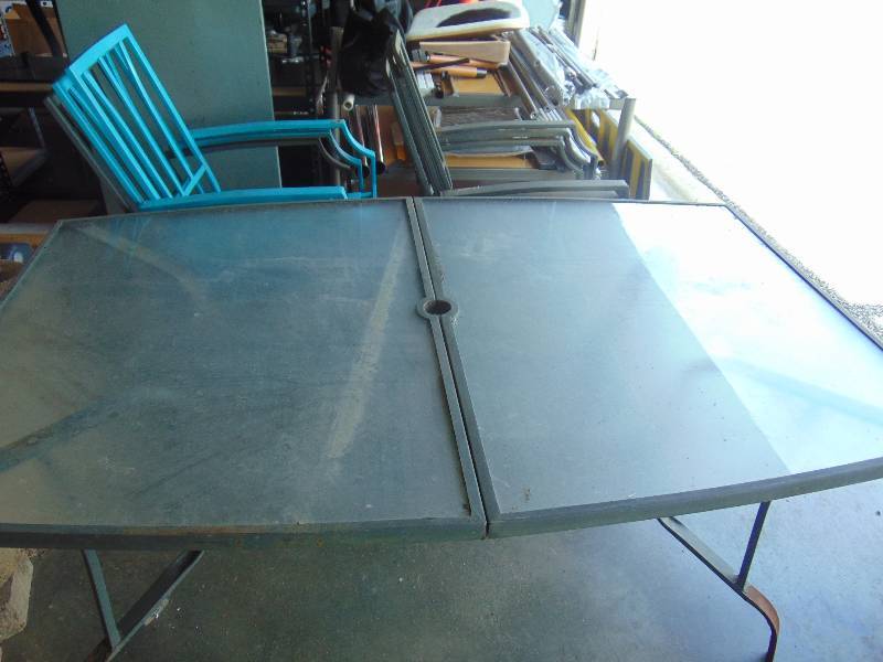 lot 2012 image: Glass Top Patio table, 38 x 63 x 28 with (6) metal chairs, used