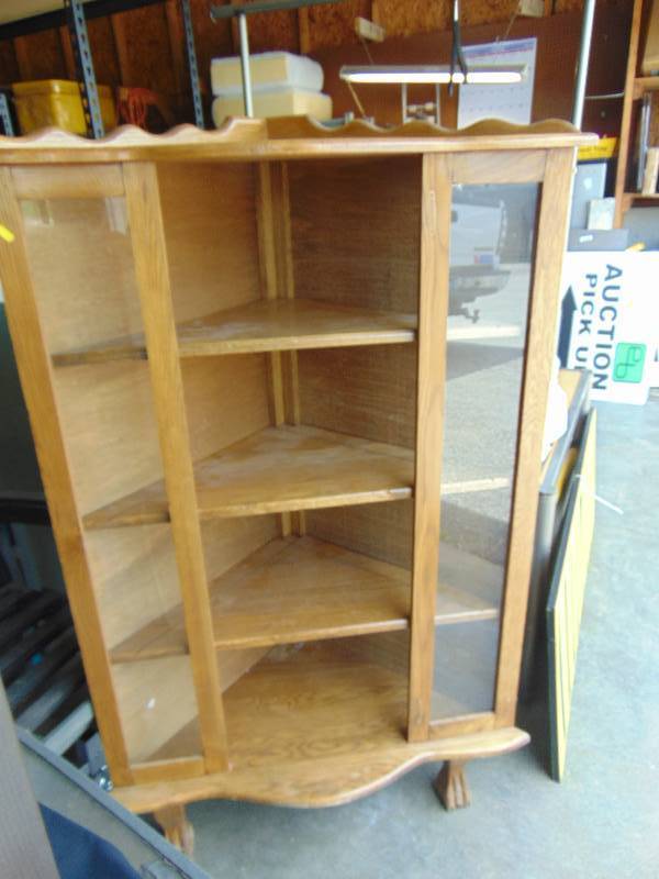 lot 2036 image: Wooden Corner Cabinet w glass panels, 34 x 26-12 x 26-12 x 59 tall at tallest point, used, door is missing