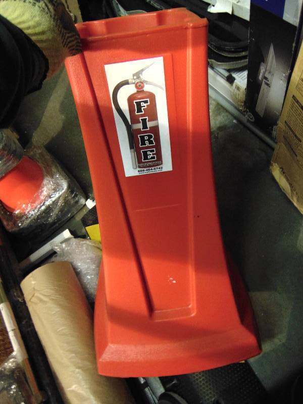 lot 1040 image: (1) Composite Plastic Fire Extinguisher Holder, 35 T x 18 x 18 base, will hold up to 7-34 diameter fire extinguisher, not included