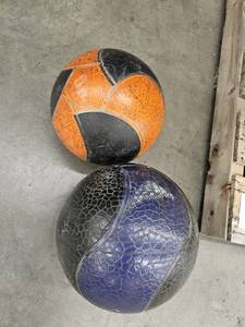lot 9831 image: (2) Weighted Balls 1 12lbs 1 unknown