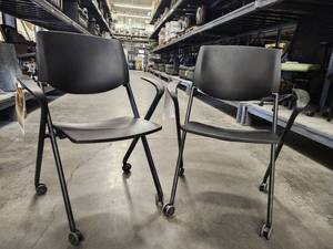lot 15662 image: (2) Black Rolling, Stackable Chairs