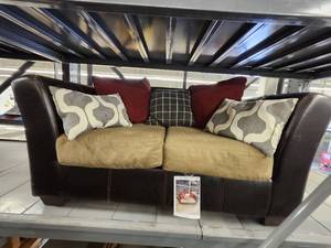 lot 15686 image: Brown, Faux Leather and Cloth Loveseat W5 Decorative Pillows