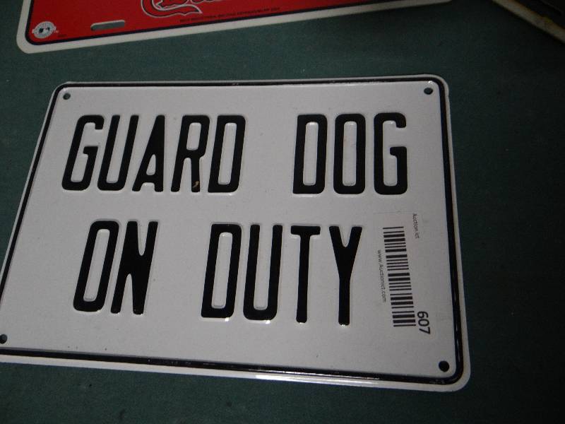 lot 607 image: Metal dog sign & 2 plastic tags