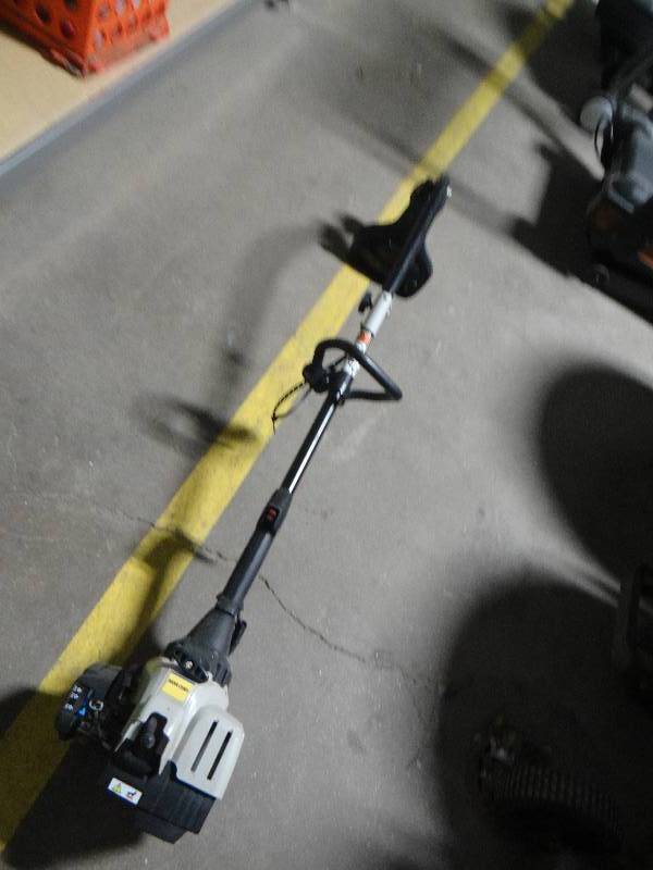 lot 648 image: Yard man curved shaft gas weed eater