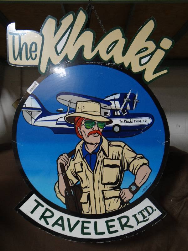 lot 414 image: The Khaki Traveler LTD wood wall sign