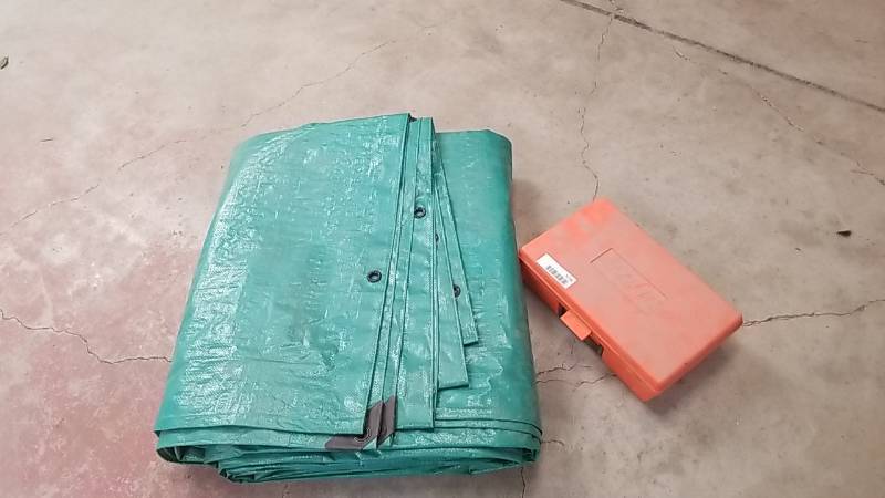 lot 7078 image: Large Tarp and Stihl Case