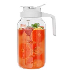 lot 76596 image: Glass Mason Jar Pitcher, 64 oz Wide Mouth Jug with Pour Spout Handle Lid for Cold Brew Coffee, Ice Beverage, Iced Juice, Lemonade, Sun Tea, Fruit Drinks Container - White