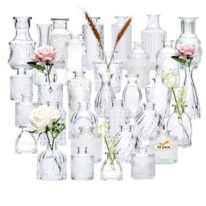 lot 10507 image: Brajttt Set of 32 Bud Vases for Flowers, Small Vintage Glass Bottles for Rustic Wedding Centerpieces and Home Decor