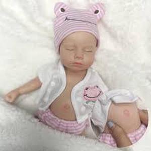 lot 11532 image: Baby Reborn Pink Striped Outfit and Matching Hat