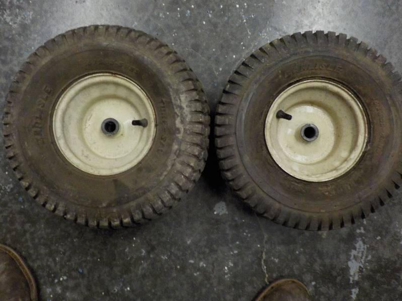 lot 4740 image: 2 Lawn mower tires and wheels. tires are Carlyle 15x6.00x6
