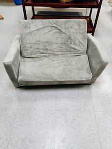 lot 935 image: Childs plush love seat. Folds out to sleeper. Side storage pocket. 42 inches long