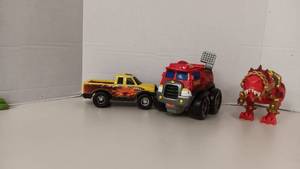 lot 1035 image: 3 Plastic Toys ( Tonka, Tonka jr, Dinosaur)