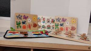lot 1042 image: 4 Wood Puzzles & Leaning Snaps, buckles & more Pouch