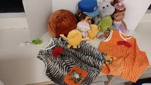 lot 1055 image: 7 Stuffed Animals & Ball, Baby Doll, 2 Animal Aprons