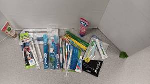 lot 1104 image: Tooth Brushes & Tooth Paste