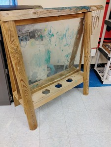 lot 1260 image: Outdoor easel Has plexiglass in middle.