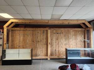 lot 10980 image: Commercial Pine Wood Display Wall with Grid System and Track Lighting