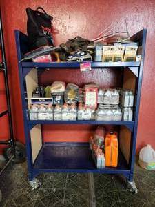 lot 19861 image: Rolling shelf, Motorcycle Parts Inventory - Husqvarna XP Oil, HiFlo Filters, and Accessories