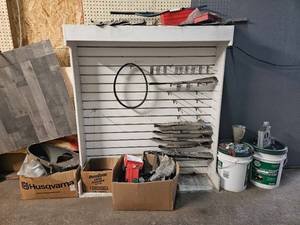 lot 21852 image: Husqvarna Lawn Mower Parts and Service Display Rack with Accessories - Retail $450