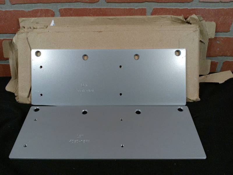 lot 210 image: LCN 18PA Drop Plates for 4050 Door Closers Aluminum Finish - Does not include hardware - NOS