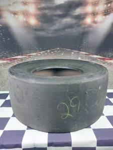 lot 37342 image: #29 Kevin Harvick tire sold from Kansas speed way early 2000s, practice tire, does not come with any authentication. All markings on tire show indications that are consistent with story from consignee.