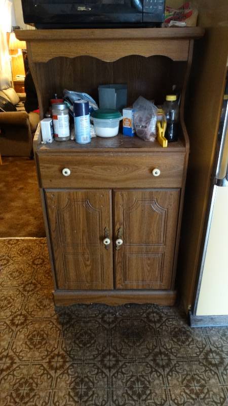 lot 1705 image: Microwave cart with contents. Microwave not included.
