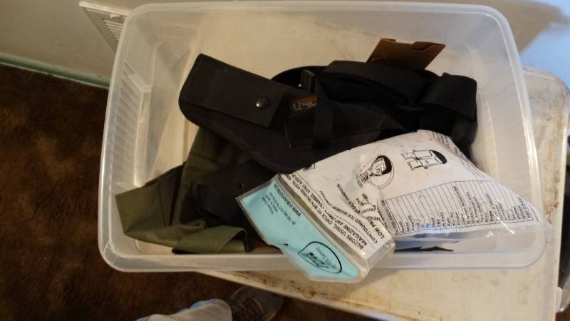 lot 1742 image: Container with uncle mikes side kick holster.