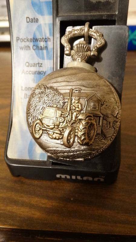 lot 1753 image: Milan pocket watch with a tractor it.