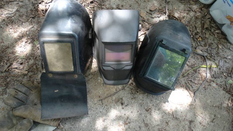 lot 1838 image: 3- welding helmets and welding gloves.