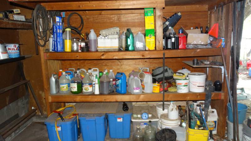 lot 1852 image: Shelf contents, hydro oil, eg carton, aluminum foil, miricle grow, jumper cables and lawn mower belt and miscellaneous.